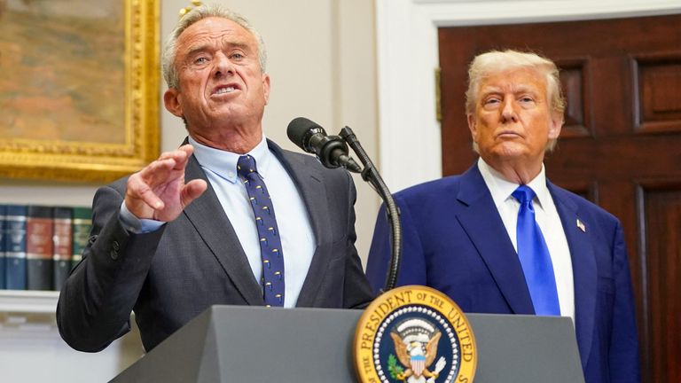 The US health secretary with President Donald Trump. Pic: Reuters