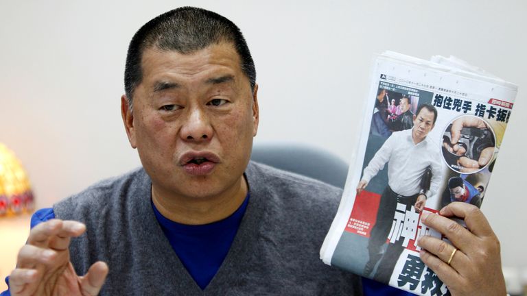 Jimmy Lai, pictured holding a copy of the Apple Daily newspaper in 2010, was arrested in 2020. File pic: Reuters