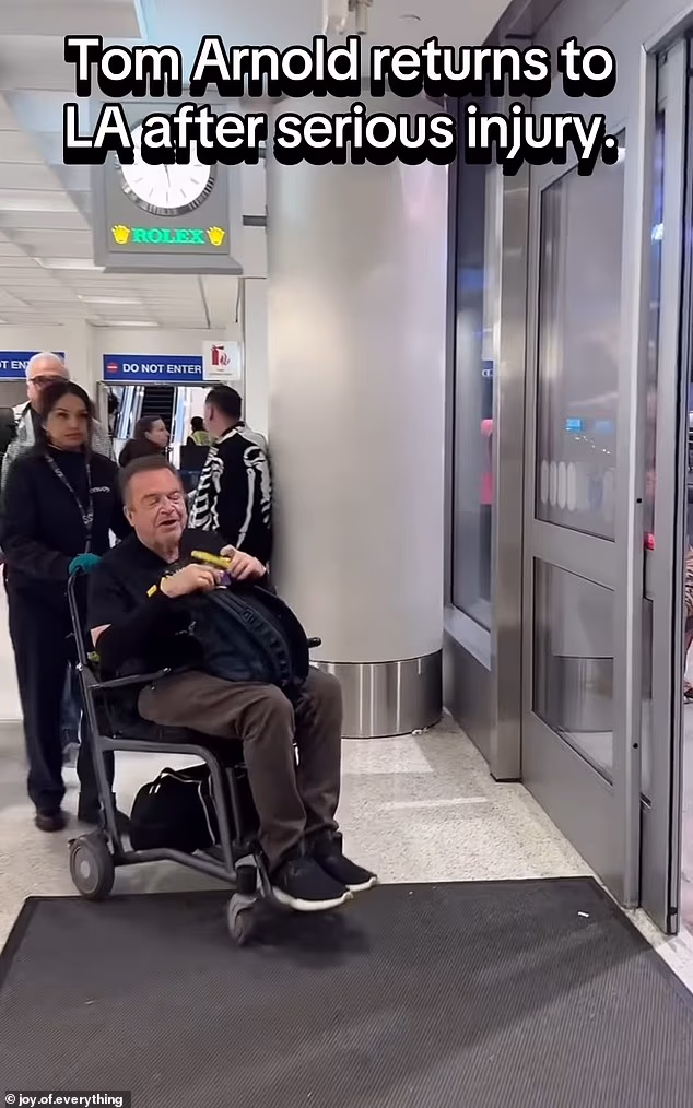The 66-year-old actor appeared in good spirits as he chatted with Joy.of.Everything's Joe Andaloro while being pushed through the airport in a wheelchair