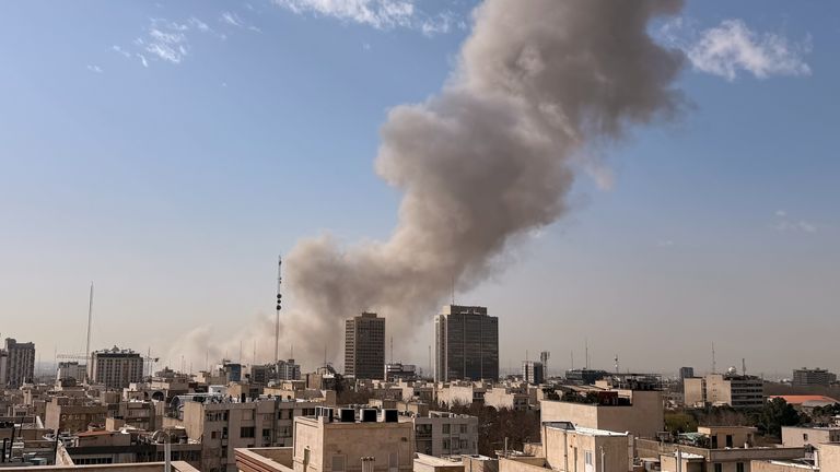 Smoke rises on the skyline after an explosion in Tehran, Iran. Pic: AP.