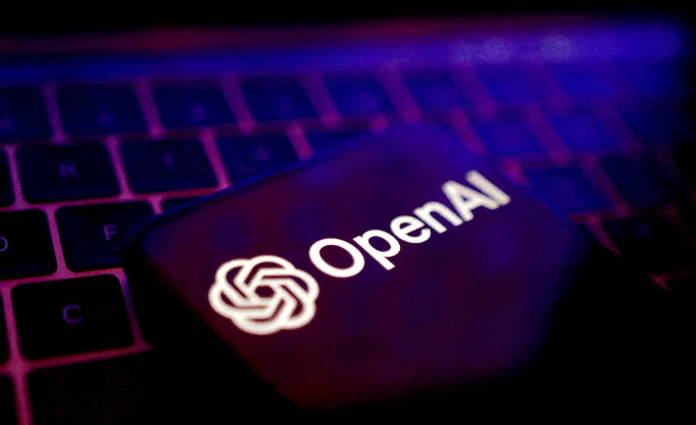 openAI logo pictured on a smartphone resting on a keyboard