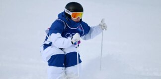 Transgender athlete competes in Winter Olympics as medal hopes hang in the balance