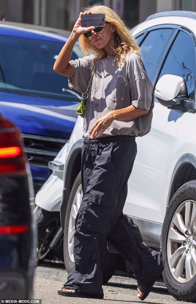 Jackie gave the impression she was eager to avoid attention as she made her way through the street