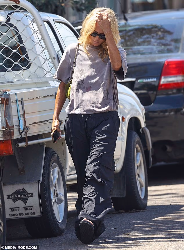 At one point, she lifted a hand to her forehead as she walked, appearing lost in thought, before later being spotted speaking quietly on her phone with her head lowered