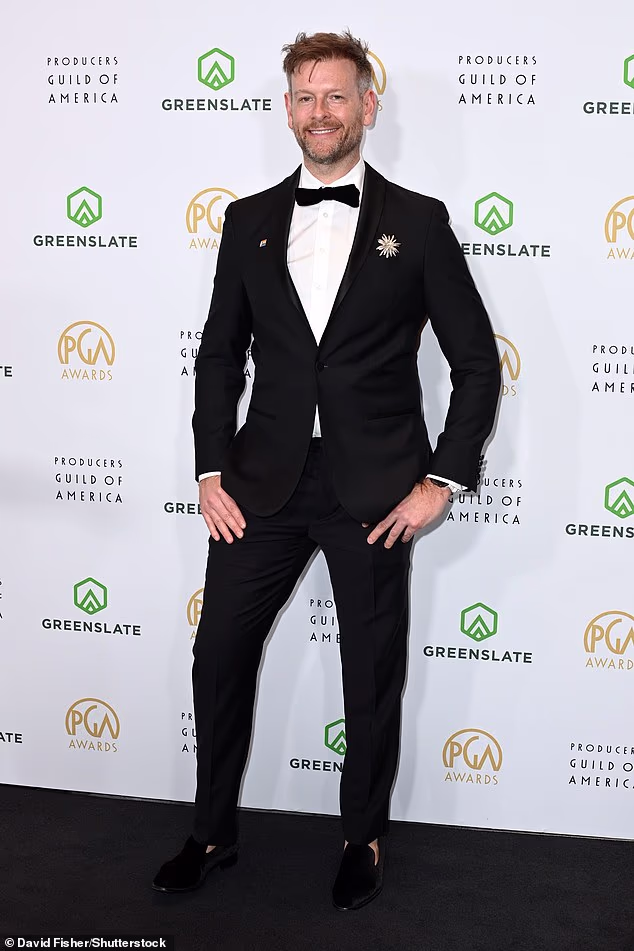 Joe Carroll was seen in a classic black suit which was paired with a white dress shirt and black bowtie