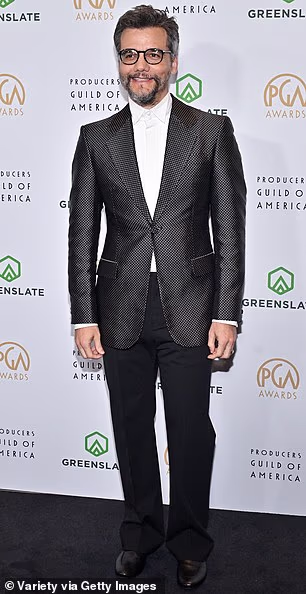 The Secret Agent actor Wager Moura stepped onto the red carpet in a dark gray suit jacket as well as black trousers. He also opted for a white shirt and sleek black loafers