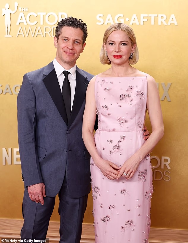 Williams was clad in a pink Prada gown as she posed on her red carpet with her spouse, director Thomas Kail, 49