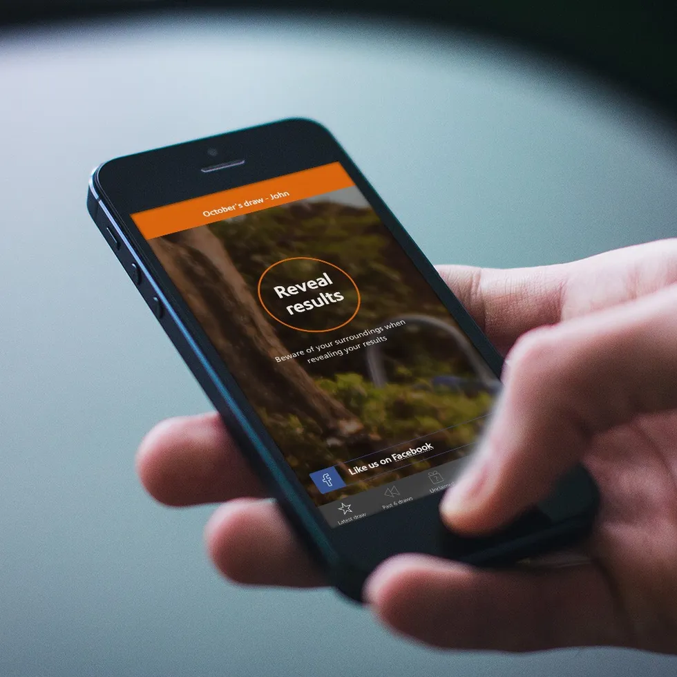 Premium Bonds user uses NS&I app on mobile phone