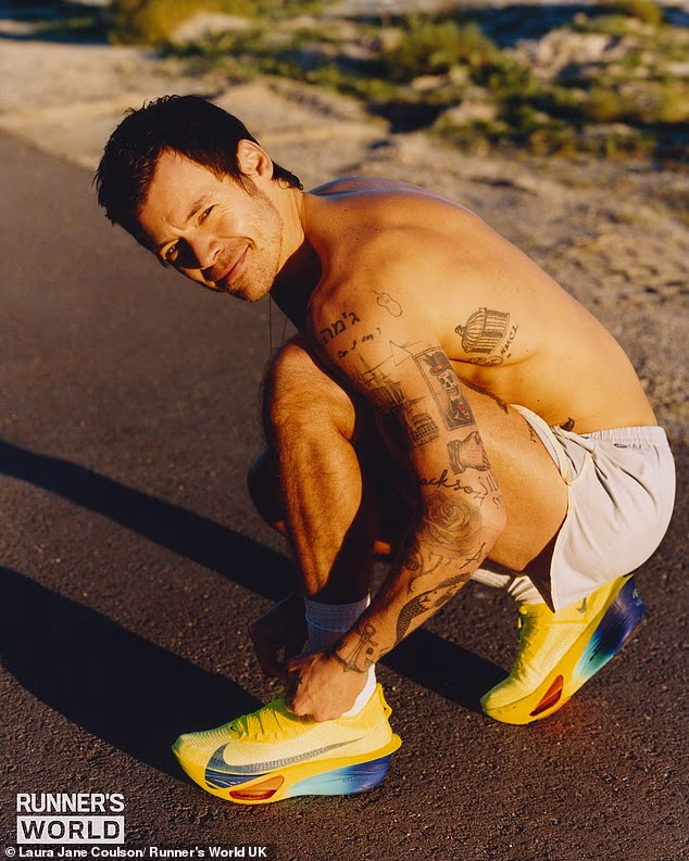 After discovering his passion for running and participating in two marathons last year, the singer, 32, displayed the hard-earned results as he appeared shirtless on the cover of Runner’s World , showing off his sculpted frame and many tattoos