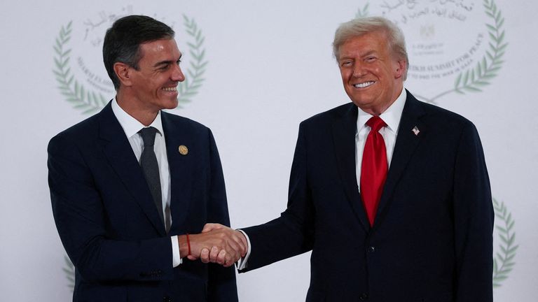 Donald Trump and Pedro Sanchez exchanging a warm greeting in October 2025. Pic: Reuters