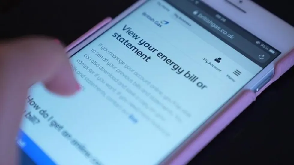 An image of a phone user checking their energy bill statement