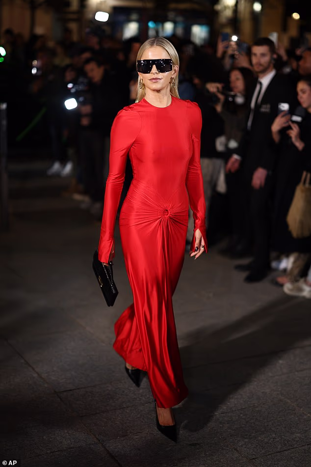 German model Caroline Daur, who was rumoured to have dated Romeo briefly, put on a striking display in a bright red satin gown featuring ruched design