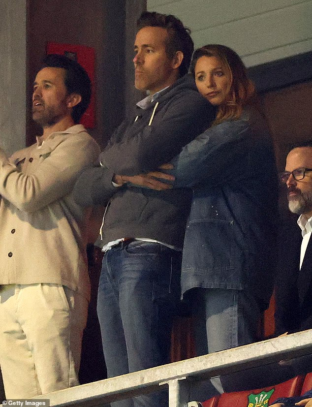 The actress could be seen cozying up to the Deadpool star as they watched the game from a private suite at the Racecourse Ground