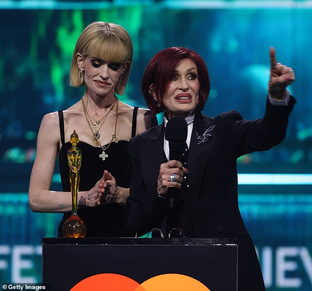 Just last week, Sharon and her daughter Kelly accepted the Lifetime Achievement Award honoring the late Black Sabbath rocker; pictured in February