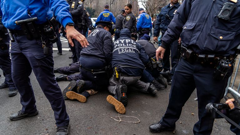 Counter-protester arrested by police. Pic: Reuters 