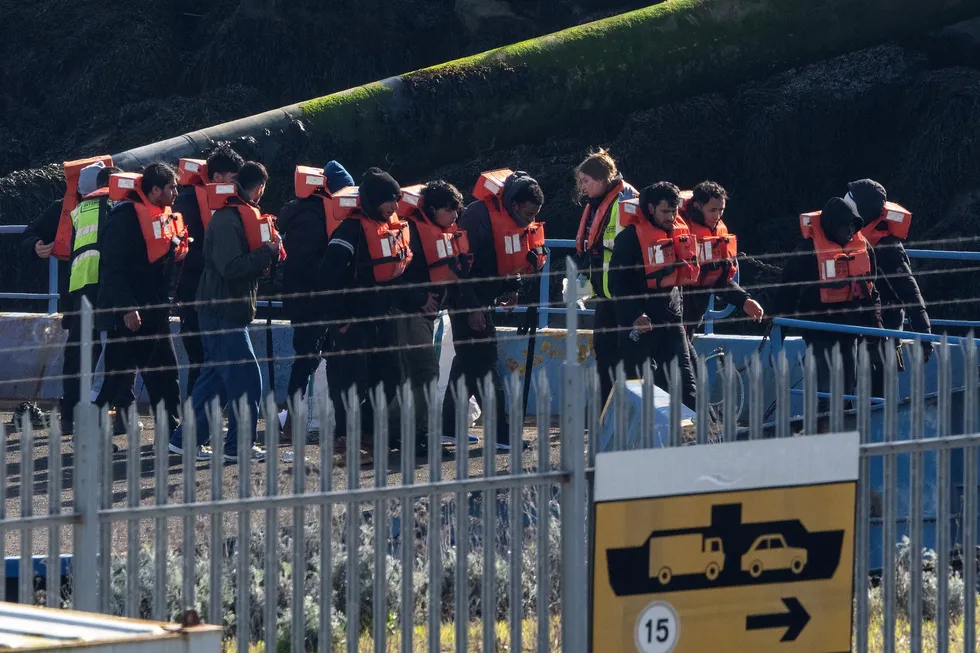 Illegal migrants after landing in Britain