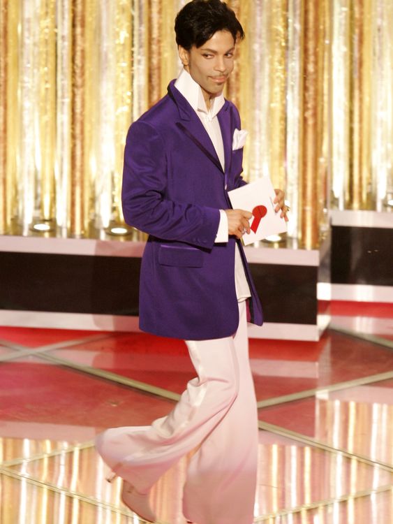 Never boring, always original. Prince in flares, heels, and his signature purple in 2005. Pic: Reuters