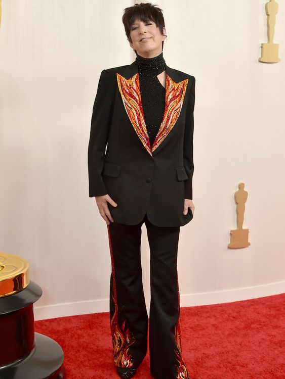 Seventeen-time Oscar nominee Diane Warren wore a flame covered suit to celebrate her nod for song The Flame Inside in 2024. Pic: AP