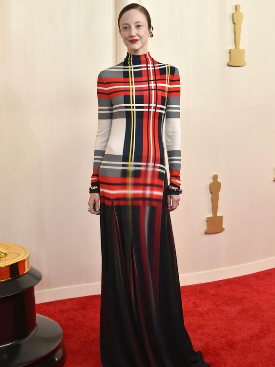 Andrea Riseborough in a Loewe plaid tartan dress in 2024, the year after her surprise nomination caused quite a stir. Pic: AP