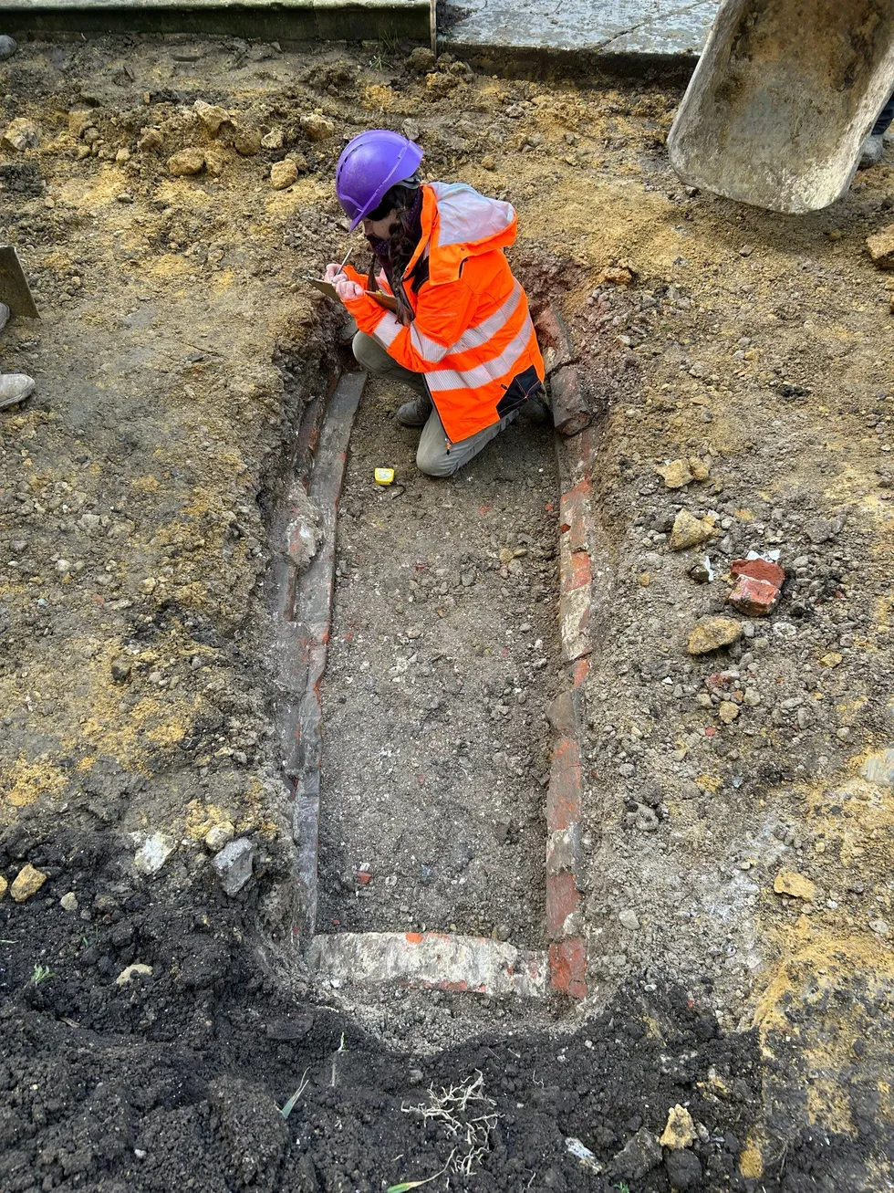\u200bA member of the Canterbury Archaeological Trust investigates the vault