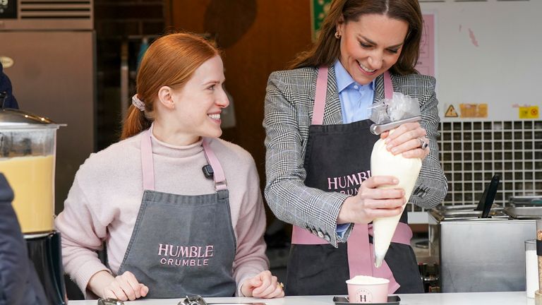 The Princess of Wales, helped by Kim Innes, at the Humble Crumble stall. Pic: PA