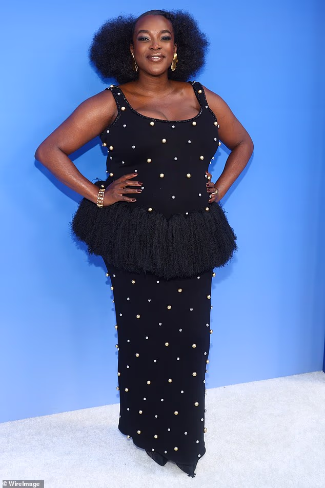 The glamorous number featured a scoop neckline, delicate pearl embellishment all over, and fringed detailing at the waist