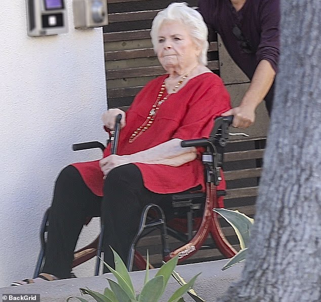 During the recent daytime excursion, Squibb was stylishly casual wearing a vibrant red shirt as well as a pair of black trousers