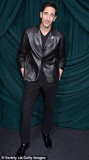 She was accompanied by partner Adrien Brody who sported black slacks as well as a leather jacket