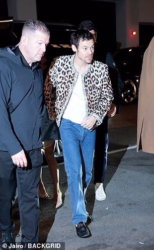 Harry added light blue jeans to the look