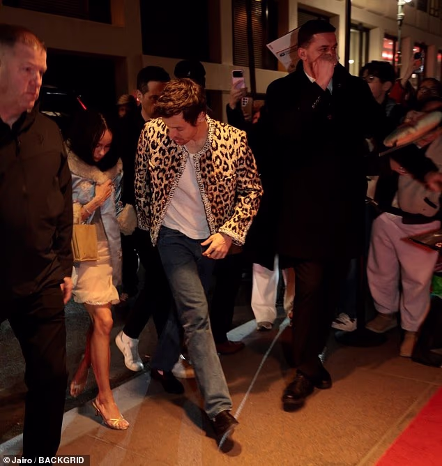 He looked back to check on Zoe as the crowds surrounded them