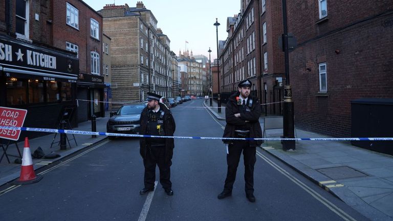 Police officers stand by a road closure at the junction of Great Peter Street and Horseferry Road. Pic: PA 