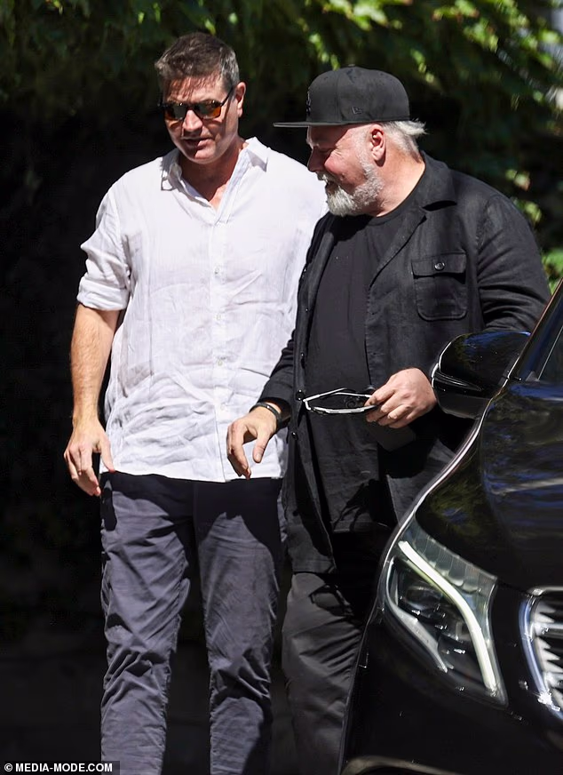 Laundy, who was carrying a notepad as he shook Sandilands' hand, downplayed his attendance at the mystery chat by claiming that it was related to his NRL interests