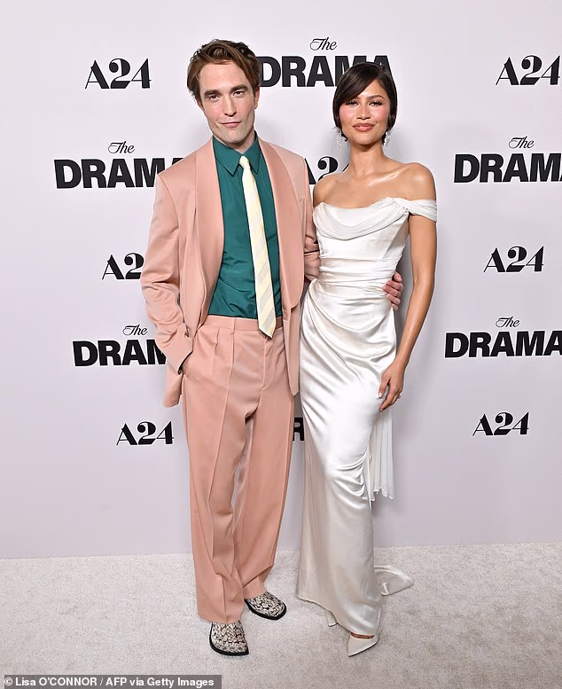 Zendaya was joined on the white carpet by Robert Pattinson, who portrays her bookstore clerk character Emma Harwood's fiancé, a British museum director Charlie Thompson, in The Drama
