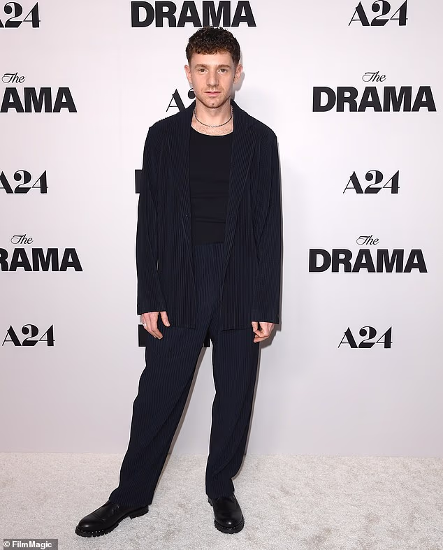 Abbott Elementary star Chris Perfetti showed a little chest hair beneath his all-black outfit