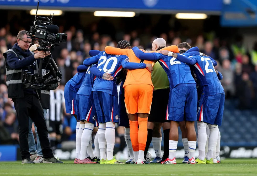 Paul Tierney found himself surrounded by Chelsea's sudden team huddle