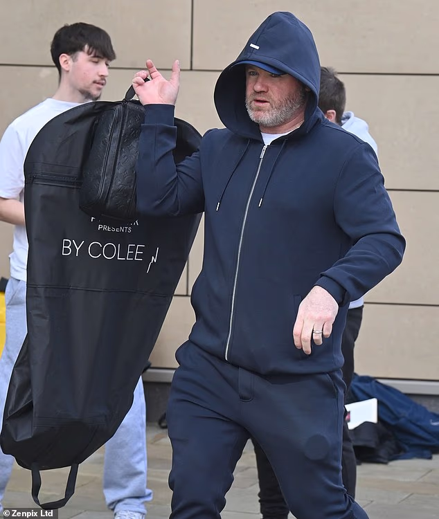 Wayne carried his suit for the recording in a bag with 'Primark presents Coleen' written on it