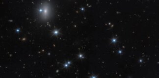 Astronomers spot nearly invisible galaxy packed with dark matter