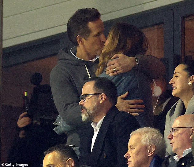 Blake Lively, 38, shared a passionate kiss with husband Ryan Reynolds during a rare joint appearance on Saturday at a soccer match in Wales
