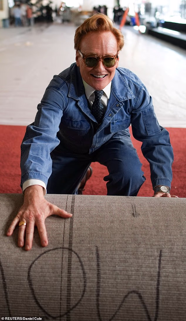 Conan O'Brien ditched his signature sleek suit for more rustic attire to host the 98th Academy Awards ceremonial red carpet roll-out, which was held outside the Dolby Theatre in Hollywood on Wednesday