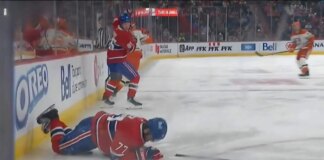 Kirby Dach leaves ice following heavy hit