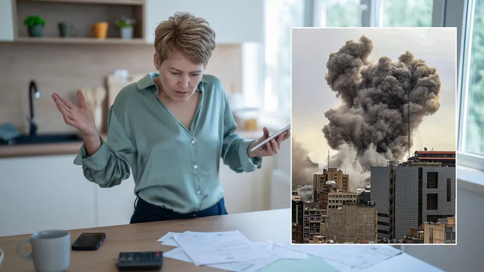 Woman looking at bills and explosion in Terhan, Iran