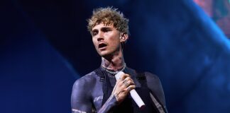 Mortifying moment show-off fan faceplants in front of thousands after falling through hole in stage at Machine Gun Kelly concert