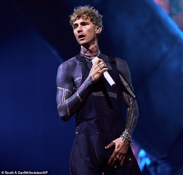 A Machine Gun Kelly fan suffered a mortifying moment after falling through a hole in the stage during the rapper's London concert on Thursday (seen above)
