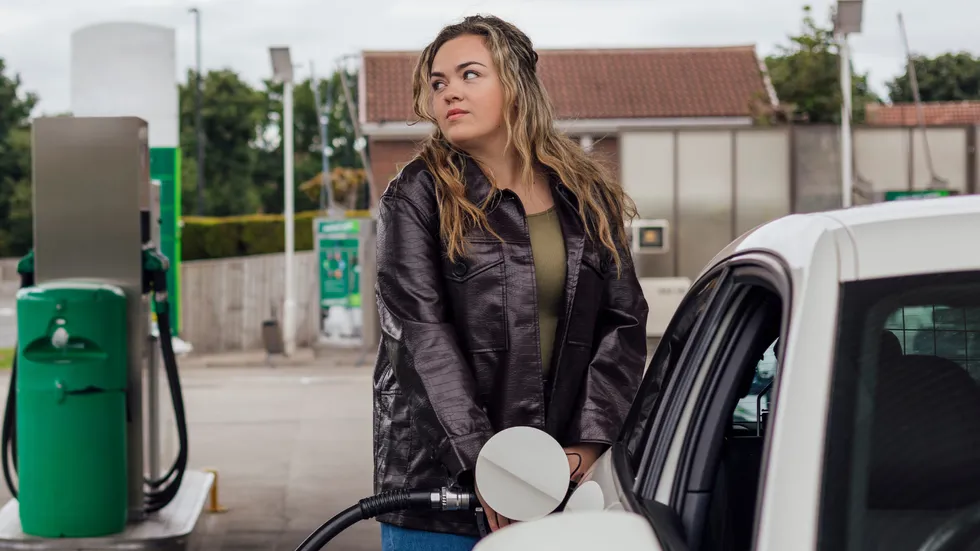 Woman filling up petrol tank