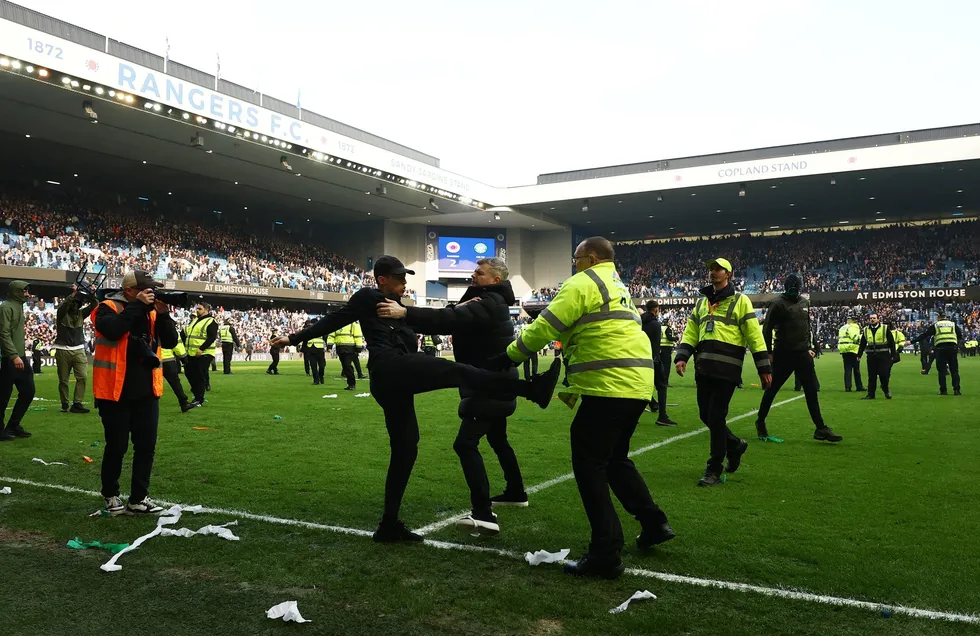 Arrests have been made after fans broke onto the pitch at Ibrox, Police Scotland have confirmed