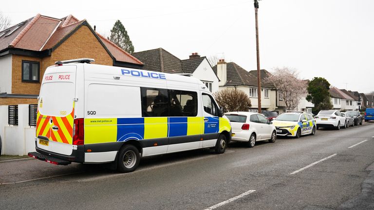 Police outside a property on Brookdene Avenue in Watford during searches. Pic: PA