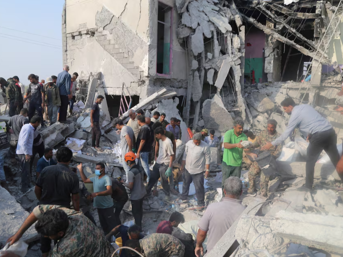 People and rescue forces work following an Israel strike on a school in Minab, Iran, February 28, 2026. Abbas Zakeri/Mehr News/WANA (West Asia News Agency) PHOTO: REUTERS