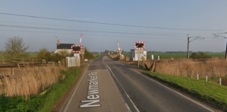 One person dies in collision involving car and train at level crossing | UK News